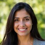 Smiling close-up of Maya Singh, with a warm, approachable expression.